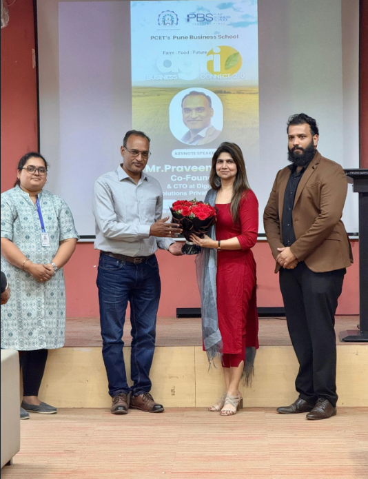 Dr. Minakshi Tyagi presenting bouquet at AgriWise PBS event